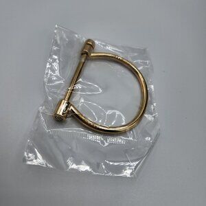 Gold  plated stainless steel horseshoe bracelet with removable pin and zirconia